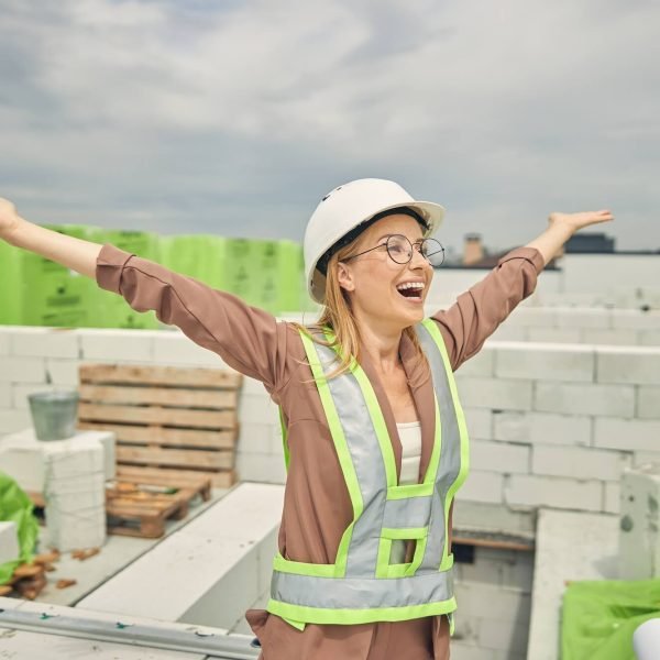 female-contractor-admiring-a-new-construction-object.jpg